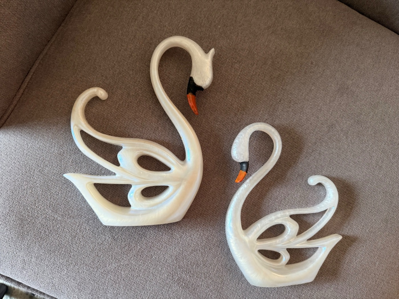 Pearlescent resin swans from the Bloom collection