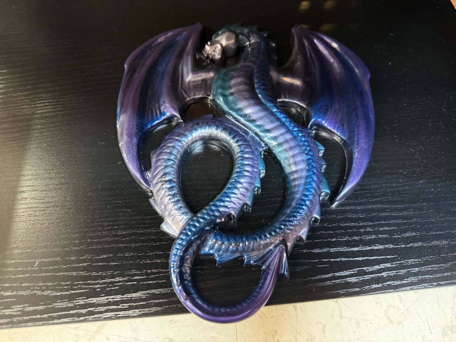 Iridescent purple and blue resin dragon wall sculpture with outstretched wings